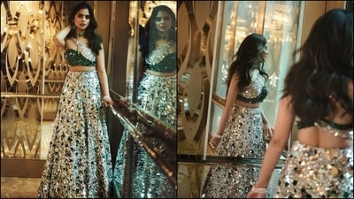 The Manish Malhotra bralette and skirt set is the perfect couture look for the modern Indian woman's ethnic wear closet. It features a one-shoulder bralette adorned with shimmering green and silver crystal, mirror and sequin embellishments. It has a cut-out on the neckline, a fitted bust, and a cropped silhouette. Meanwhile, the A-line skirt has a high-rise waist, minimum flare, and a floor-grazing hem. (Instagram) The Manish Malhotra bralette and skirt set is the perfect couture look for the modern Indian woman's ethnic wear closet. It features a one-shoulder bralette adorned with shimmering green and silver crystal, mirror and sequin embellishments. It has a cut-out on the neckline, a fitted bust, and a cropped silhouette. Meanwhile, the A-line skirt has a high-rise waist, minimum flare, and a floor-grazing hem. (Instagram)