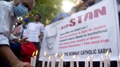 Mumbai, India - July 06, 2021: Members of The Bombay Catholic Sabha hold a memorial mass outside St. Peter's Church in Bandra in protest holding banners and lighting candles for the Indian rights activist and Jesuit priest Father Stan Swamy, who was detained for nine months under Indian anti-terrorism law without trial, died on Monday ahead on his bail hearing, in Mumbai, India on Saturday, July 06, 2021. (Photo by Vijay Bate/HT Photo) (HT PHOTO) Mumbai, India - July 06, 2021: Members of The Bombay Catholic Sabha hold a memorial mass outside St. Peter's Church in Bandra in protest holding banners and lighting candles for the Indian rights activist and Jesuit priest Father Stan Swamy, who was detained for nine months under Indian anti-terrorism law without trial, died on Monday ahead on his bail hearing, in Mumbai, India on Saturday, July 06, 2021. (Photo by Vijay Bate/HT Photo) (HT PHOTO)