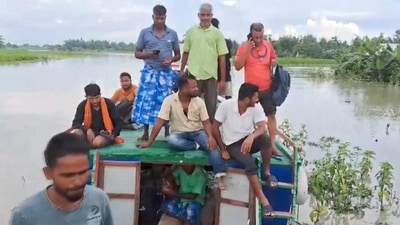 Flood-affected people move to a safer place on a boat in Nalbari district on Friday, July 5, 2024. (PTI Photo) Flood-affected people move to a safer place on a boat in Nalbari district on Friday, July 5, 2024. (PTI Photo)