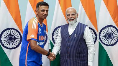 Prime Minister Narendra Modi with India head coach Rahul Dravid. (ANI)