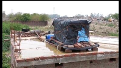 Wrapped under tarpaulin, belongings placed on the roof of a house in Patiala on Saturday. (HT) Wrapped under tarpaulin, belongings placed on the roof of a house in Patiala on Saturday. (HT)
