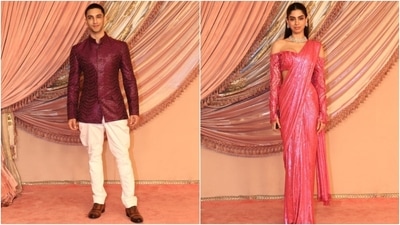 Vedang Raina and Khushi Kapoor wore similar-toned outfits to Anant Ambani and Radhika Merchant's sangeet ceremony. While Vedang chose a maroon sequinned short bandhgala jacket and white skinny dhoti pants, Khushi complemented him in a sequinned Barbie pink-coloured saree and an off-shoulder blouse. (HT Photo/Varinder Chawla) Vedang Raina and Khushi Kapoor wore similar-toned outfits to Anant Ambani and Radhika Merchant's sangeet ceremony. While Vedang chose a maroon sequinned short bandhgala jacket and white skinny dhoti pants, Khushi complemented him in a sequinned Barbie pink-coloured saree and an off-shoulder blouse. (HT Photo/Varinder Chawla)
