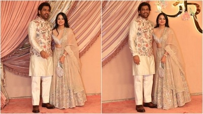 MS Dhoni and wife Sakshi also attended Anant Ambani and Radhika Merchant's sangeet ceremony. While the cricketer wore a cream silk kurta, floral embroidered jacket, and white pants, Sakshi dazzled in an off-shoulder blouse, flared lehenga, and a net dupatta. (HT Photo/Varinder Chawla) MS Dhoni and wife Sakshi also attended Anant Ambani and Radhika Merchant's sangeet ceremony. While the cricketer wore a cream silk kurta, floral embroidered jacket, and white pants, Sakshi dazzled in an off-shoulder blouse, flared lehenga, and a net dupatta. (HT Photo/Varinder Chawla)