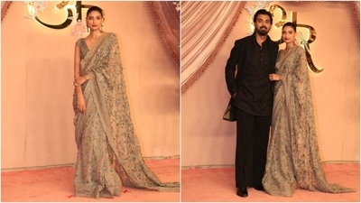 Athiya Shetty chose a floral-embroidered beige saree and a sleeveless blouse for Anant Ambani and Radhika Merchant's sangeet ceremony. KL Rahul complemented his wife in a black kurta, bandhgala jacket, and matching pants set. (HT Photo/Varinder Chawla) Athiya Shetty chose a floral-embroidered beige saree and a sleeveless blouse for Anant Ambani and Radhika Merchant's sangeet ceremony. KL Rahul complemented his wife in a black kurta, bandhgala jacket, and matching pants set. (HT Photo/Varinder Chawla)