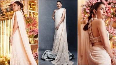 Ambani's badi bahu Shloka Mehta radiated elegance in an exquisite Tamara Ralph saree at sangeet ceremony. The saree, in a pristine white shade adorned with floral embellishments, was paired with a pearl-studded halter-neck blouse, completing her stunning look. (Instagram/@dmjatia) Ambani's badi bahu Shloka Mehta radiated elegance in an exquisite Tamara Ralph saree at sangeet ceremony. The saree, in a pristine white shade adorned with floral embellishments, was paired with a pearl-studded halter-neck blouse, completing her stunning look. (Instagram/@dmjatia)