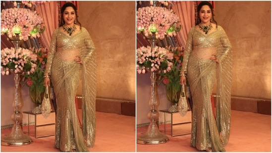 Talking about sarees and not mentioning Madhuri Dixit wouldn't be fair. The actor donned a stunning sheer golden saree featuring sequin patterns all over. She paired it with a full-sleeved golden sweetheart neckline blouse, a bejewelled potli bag, and a heavy green emerald-studded necklace, radiating regal vibes.(HT photo/VarinderChawla)