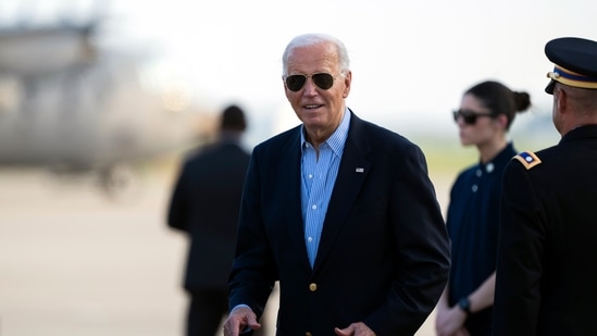 President Joe Biden responds to questions from the traveling press as he arrives at Delaware Air National Guard Base in New Castle, Del., Friday, July 5, 2024, from a campaign rally in Madison, Wis. (AP Photo/Manuel Balce Ceneta)