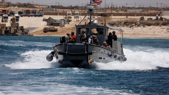 An American boat carrying American soldiers and journalist sails near the Trident Pier, a temporary pier to deliver aid, off the Gaza Strip, amid the ongoing conflict between Israel and Hamas, near the Gaza coast, June 25, 2024. REUTERS/Amir Cohen     TPX IMAGES OF THE DAY