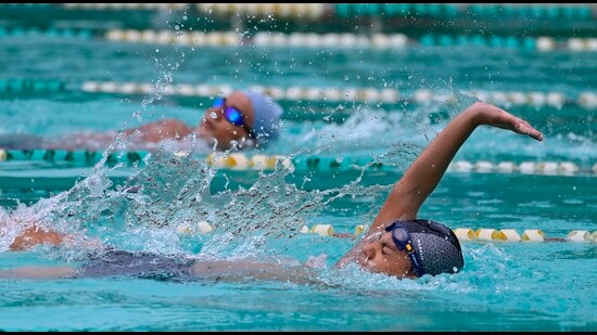 Players in action during the district swimming tournament in Ludhiana on Saturday. (Gurpreet Singh/HT)