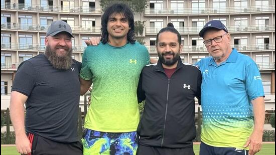 Reigning Olympic champion Neeraj Chopra with his team. (IIS/X)