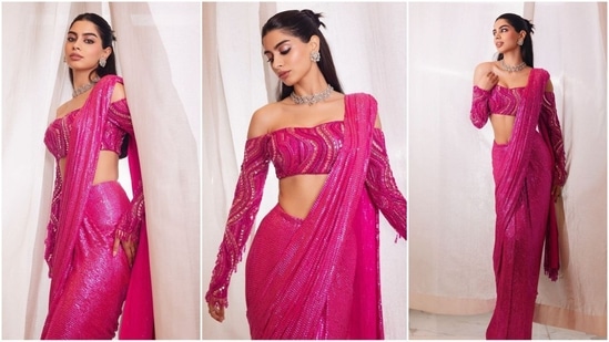 Khushi Kapoor dazzles in a vibrant pink saree adorned with enchanting sequin work all over. She elegantly draped it with the pallu falling from her shoulders and paired with an off-shoulder, full-sleeves blouse for a stunning look.(Instagram/@khushi05k)