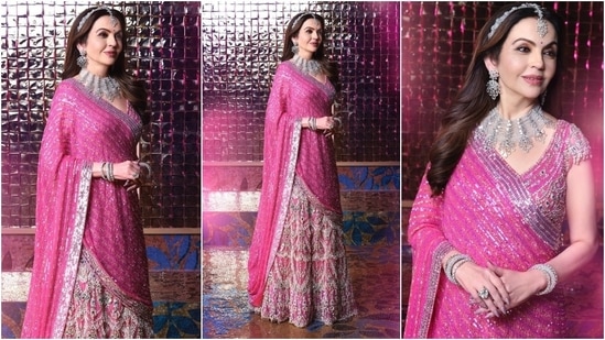 Looking regal as ever, Nita Ambani wore a bejewelled Falguni Shane Peacock lehenga to Anant and Radhika's sangeet. The pink ensemble comes decked in pearl tassels, blue sapphire gemstones, Resham work, and sequin embroidery. A matha patti, bracelets, rings, earrings, a choker necklace, and striking glam rounded off the look.&nbsp;(Instagram)