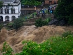 People watch the flooded Bagmati river in Kathmandu, Nepal, Saturday, July 6, 2024. AP/PTI People watch the flooded Bagmati river in Kathmandu, Nepal, Saturday, July 6, 2024. AP/PTI