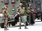 Army personnel stand guard at the encounter site where a jawan was killed in a gunfight with terrorists, in Kulgam. (ANI) Army personnel stand guard at the encounter site where a jawan was killed in a gunfight with terrorists, in Kulgam. (ANI)