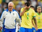 Brazil's coach Dorival Junior, right escorts off the field Lucas Paqueta (8) and teammates after their lost in a penalty shootout against Uruguay during a Copa America quarterfinal soccer match in Las Vegas, Saturday Brazil's coach Dorival Junior, right escorts off the field Lucas Paqueta (8) and teammates after their lost in a penalty shootout against Uruguay during a Copa America quarterfinal soccer match in Las Vegas, Saturday