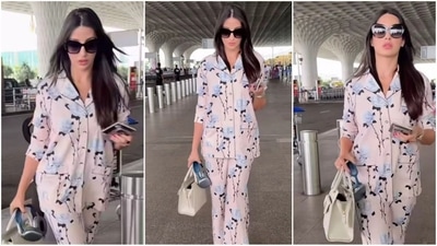 Nora Fatehi's airport fashion is all about comfort and style. Her latest look features a trendy co-ord set in a baby pink shade adorned with captivating blue floral print. Paired with a white handbag, oversized glasses, and loose hair, she finishes off her look effortlessly. (Instagram/@ViralBhayani) Nora Fatehi's airport fashion is all about comfort and style. Her latest look features a trendy co-ord set in a baby pink shade adorned with captivating blue floral print. Paired with a white handbag, oversized glasses, and loose hair, she finishes off her look effortlessly. (Instagram/@ViralBhayani)