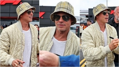 Brad Pitt rocks an outfit by Burberry as he hangs out with fans at the qualifying day of the 2024 F1 British Grand Prix. His ensemble features a checkered bucket hat, a puffy beige jacket, a white t-shirt, and a pair of sunglasses. (Instagram/@justjared) Brad Pitt rocks an outfit by Burberry as he hangs out with fans at the qualifying day of the 2024 F1 British Grand Prix. His ensemble features a checkered bucket hat, a puffy beige jacket, a white t-shirt, and a pair of sunglasses. (Instagram/@justjared)