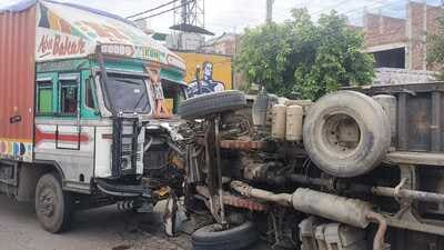 A tipper filled with gravel overturned on Landran road near Adarsh Nagar, Kharar, on Sunday after the driver had to apply emergency brakes to avoid collision with a Hyundai i-20 car but got hit by another truck from the rear side. (HT Photo)