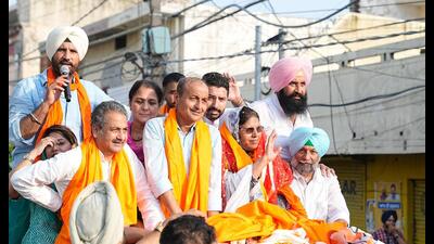 Congress leaders during a roadshow in Jalandhar West constituency on Sunday. (HT photo)