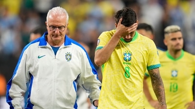 Brazil's coach Dorival Junior, right escorts off the field Lucas Paqueta (8) and teammates after their lost in a penalty shootout against Uruguay during a Copa America quarterfinal soccer match in Las Vegas, Saturday (AP) Brazil's coach Dorival Junior, right escorts off the field Lucas Paqueta (8) and teammates after their lost in a penalty shootout against Uruguay during a Copa America quarterfinal soccer match in Las Vegas, Saturday (AP)