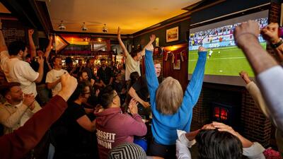 Fans react as England goalkeeper Jordan Pickford saves a penalty during the shootout against Switzerland on Saturday. (AP) Fans react as England goalkeeper Jordan Pickford saves a penalty during the shootout against Switzerland on Saturday. (AP)