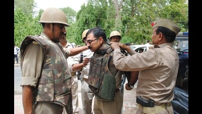 File photos of late Mukul Dwivedi, the then SP City of Mathura donning a bullet proof jacket before entering Jawahar Bagh in Mathura on June 2, 2016. Dwivedi was allegedly attacked by cult members encroaching on Jawahar Bagh and killed. (HT FILE) File photos of late Mukul Dwivedi, the then SP City of Mathura donning a bullet proof jacket before entering Jawahar Bagh in Mathura on June 2, 2016. Dwivedi was allegedly attacked by cult members encroaching on Jawahar Bagh and killed. (HT FILE)