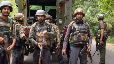 Security personnel stand guard during an encounter with terrorists, in Kulgam, Jammu and Kashmir. (PTI) Security personnel stand guard during an encounter with terrorists, in Kulgam, Jammu and Kashmir. (PTI)