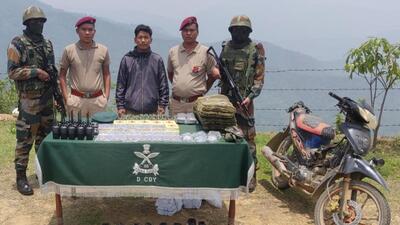 Security personnel with seized walkie talkie sets. (HT Photo)