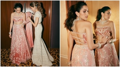 Shloka wore a peach-coloured lehenga set designed by Manish Malhotra during the sangeet ceremony. The ensemble is inspired by Kareena Kapoor's blouse and palazzo pants set she wore for Bole Chudiyan in Kabhi Khushi Kabhie Gham. It features a backless one-shoulder blouse, an A-line lehenga skirt, and a dupatta.&nbsp; (Instagram)