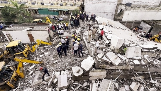 Police and fire department personnel conduct a rescue operation after a Four-floor building collapsed, in the Sachin area, Surat on Saturday. (ANI ) Police and fire department personnel conduct a rescue operation after a Four-floor building collapsed, in the Sachin area, Surat on Saturday. (ANI )