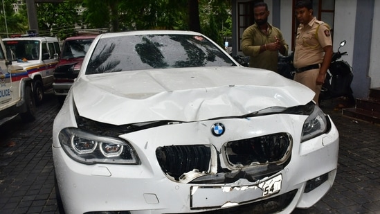 Worli hit and run case BMW car standing at premises of worli police station and police official inspecting car at parking stand of worli police station, at Worli, in Mumbai, India, on Sunday, July 07, 2024. (Photo by Bhushan Koyande/HT Photo)
