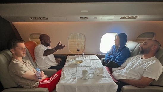 In one picture, Justin can be seen engrossed in a conversation while traveling on his private plane. 