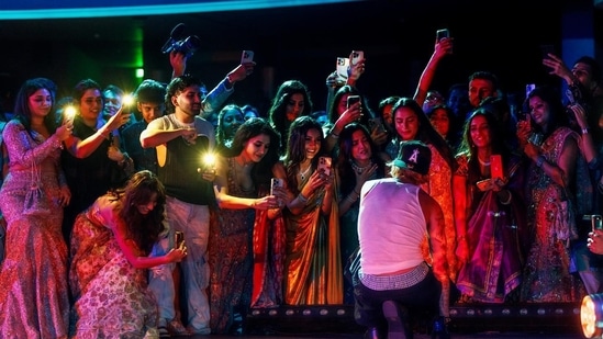 Justin also shared a picture which shows an excited group, also featuring Shehnaaz Gill and Disha Patani, capturing the moment on their phone. 