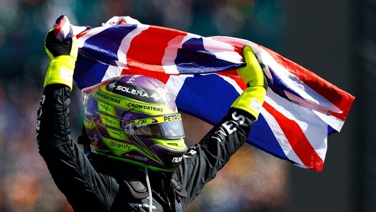 Mercedes' Lewis Hamilton celebrates after winning the British Grand Prix (REUTERS)
