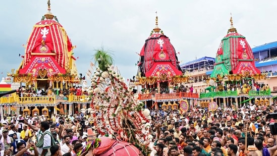 Devotees participate in the Rath Yatra of Lord Jagannath, in Puri.