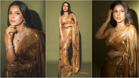 Shehnaaz Gill's golden saree look from Anant Ambani and Radhika Merchant's sangeet is creating quite a buzz on social media. Draped in six yards of pure elegance, she exudes an unmatched charm, making her look absolutely swoon-worthy. Let's decode her stunning appearance and take some fashion notes from the diva.(Instagram/@Shehnaaz Gill)