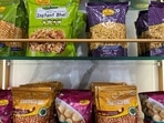 A view shows packets of snacks on the shelves inside a Haldiram's restaurant in Mumbai, India.