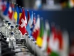 This photograph shows the Swiss flag set among the flags of the other countries during a plenary session at the Summit on peace in Ukraine, at the luxury Burgenstock resort, near Lucerne. (Photo by URS FLUEELER / POOL / AFP)(AFP) This photograph shows the Swiss flag set among the flags of the other countries during a plenary session at the Summit on peace in Ukraine, at the luxury Burgenstock resort, near Lucerne. (Photo by URS FLUEELER / POOL / AFP)(AFP)