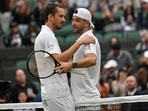 Bulgaria's Grigor Dimitrov (R) is consoled by Russia's Daniil Medvedev after retiring from their men's singles fourth round tennis match on the seventh day of the 2024 Wimbledon Championships at The All England Lawn Tennis and Croquet Club in Wimbledon, southwest London, on July 7, 2024. (Photo by ANDREJ ISAKOVIC / AFP) / RESTRICTED TO EDITORIAL USE Bulgaria's Grigor Dimitrov (R) is consoled by Russia's Daniil Medvedev after retiring from their men's singles fourth round tennis match on the seventh day of the 2024 Wimbledon Championships at The All England Lawn Tennis and Croquet Club in Wimbledon, southwest London, on July 7, 2024. (Photo by ANDREJ ISAKOVIC / AFP) / RESTRICTED TO EDITORIAL USE