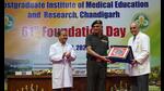 PGIMER director Dr Vivek Lal (R) felicitating chief guest Director General, Armed Forces Medical Services, and PGIMER alumnus Lt Gen Daljit Singh (C) during the Foundation Day celebrations on Monday. (HT Photo)