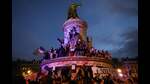 Participants wave French national tricolors during an election night rally following the first results of the second round of France's legislative election at Place de la Republique in Paris on July 7, 2024. (Photo by Emmanuel Dunand / AFP) (AFP) Participants wave French national tricolors during an election night rally following the first results of the second round of France's legislative election at Place de la Republique in Paris on July 7, 2024. (Photo by Emmanuel Dunand / AFP) (AFP)