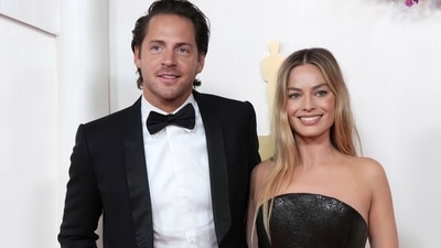 Tom Ackerley, left, and Margot Robbie arrive at the Oscars on Sunday, March 10, 2024, at the Dolby Theatre in Los Angeles. (Jordan Strauss/Invision/AP) Tom Ackerley, left, and Margot Robbie arrive at the Oscars on Sunday, March 10, 2024, at the Dolby Theatre in Los Angeles. (Jordan Strauss/Invision/AP)
