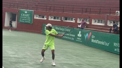 A player in action during the AITA meet being held at CITA stadium, Sector 10, Chandigarh. (HT Photo)