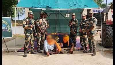 BSF personnel with the accused in Ferozepur. (HT photo)