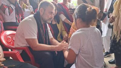 Rahul Gandhi interacting with inmates of a relief camp of displaced Manipur residents in Assam’s Cachar district. (Biswa Kalyan Purkayastha | HT photo)