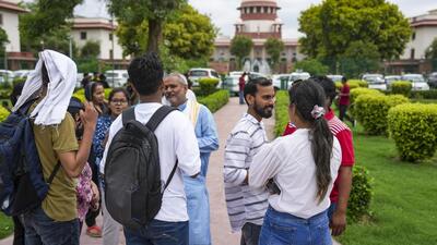 Students and others at the Supreme Court on Monday as the court began to hear petitions regarding the alleged irregularities in the administration of NEET UG 2024 exams. (PTI photo) Students and others at the Supreme Court on Monday as the court began to hear petitions regarding the alleged irregularities in the administration of NEET UG 2024 exams. (PTI photo)