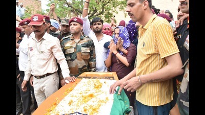 The mortal remains of Lance Naik Pradeep Nain, who was killed in action in an encounter in Jammu and Kashmir’s Kulgam district, were consigned to flames with full military honours at his native village Jajanwala in Jind on Monday. (Manoj Dhaka/ HT Photo) The mortal remains of Lance Naik Pradeep Nain, who was killed in action in an encounter in Jammu and Kashmir’s Kulgam district, were consigned to flames with full military honours at his native village Jajanwala in Jind on Monday. (Manoj Dhaka/ HT Photo)