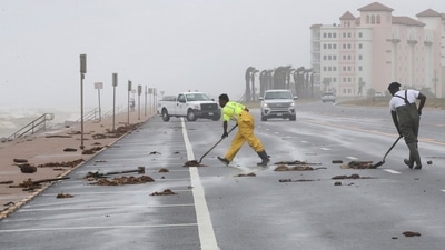 City of Galveston workers clear debris from Beryl from the West End of the seawall in Galveston, Texas, on Monday, July 8, 2024. Tropical Storm Beryl was unleashing heavy rains and powerful winds along the Texas coast, knocking out power to more than 2 million homes and businesses and flooding streets with fast-rising waters. (Jennifer Reynolds/The Galveston County Daily News via AP) (AP) City of Galveston workers clear debris from Beryl from the West End of the seawall in Galveston, Texas, on Monday, July 8, 2024. Tropical Storm Beryl was unleashing heavy rains and powerful winds along the Texas coast, knocking out power to more than 2 million homes and businesses and flooding streets with fast-rising waters. (Jennifer Reynolds/The Galveston County Daily News via AP) (AP)
