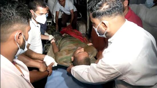 A jawan being taken to Billawar Health Center as he was injured after terrorists attacked an army convoy in Billawar, in Kathua on Monday. (ANI) A jawan being taken to Billawar Health Center as he was injured after terrorists attacked an army convoy in Billawar, in Kathua on Monday. (ANI)
