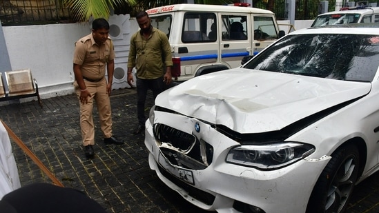 Worli hit and run case BMW car standing at premises of worli police station and police official inspecting car at parking stand of worli police station, at Worli, in Mumbai, India, on Sunday, July 07, 2024. (Photo by Bhushan Koyande/HT Photo)